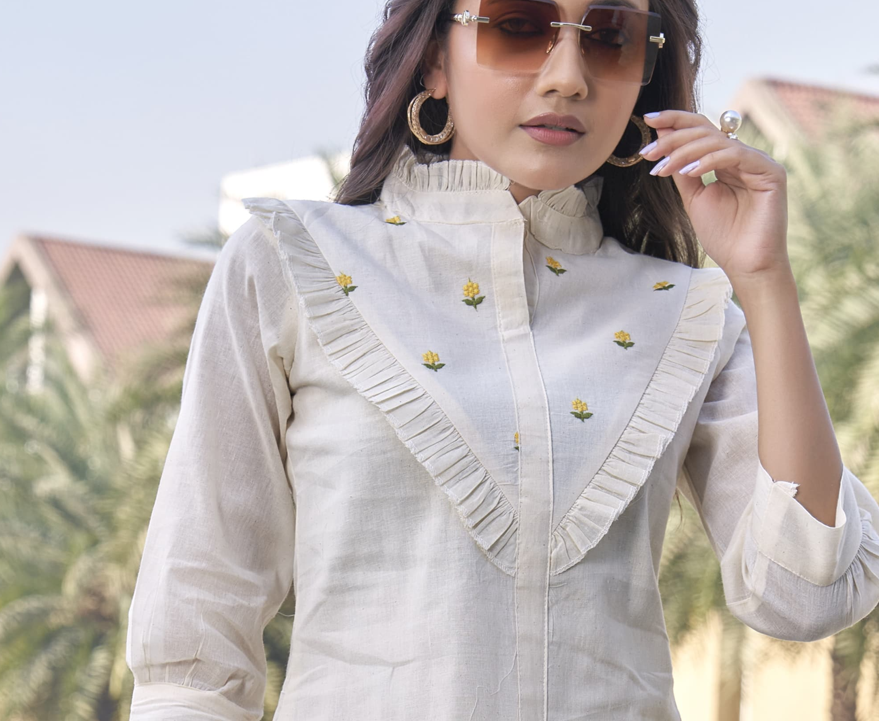 🌼 Ira – High Neck Pleated Khadi Top with Yellow Floral Embroidery 🌿